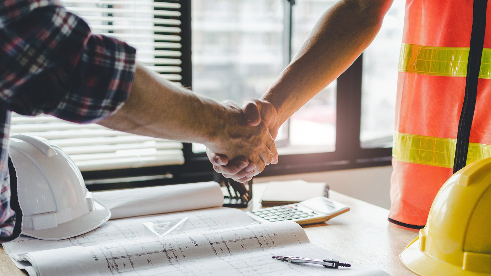 Construction Worker Shaking Hands