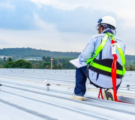 Man inspecting a roof