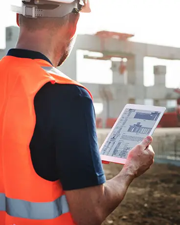 Man assessing real time data on the jobsite