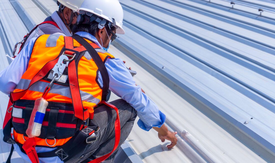 Workers inspecting a roof