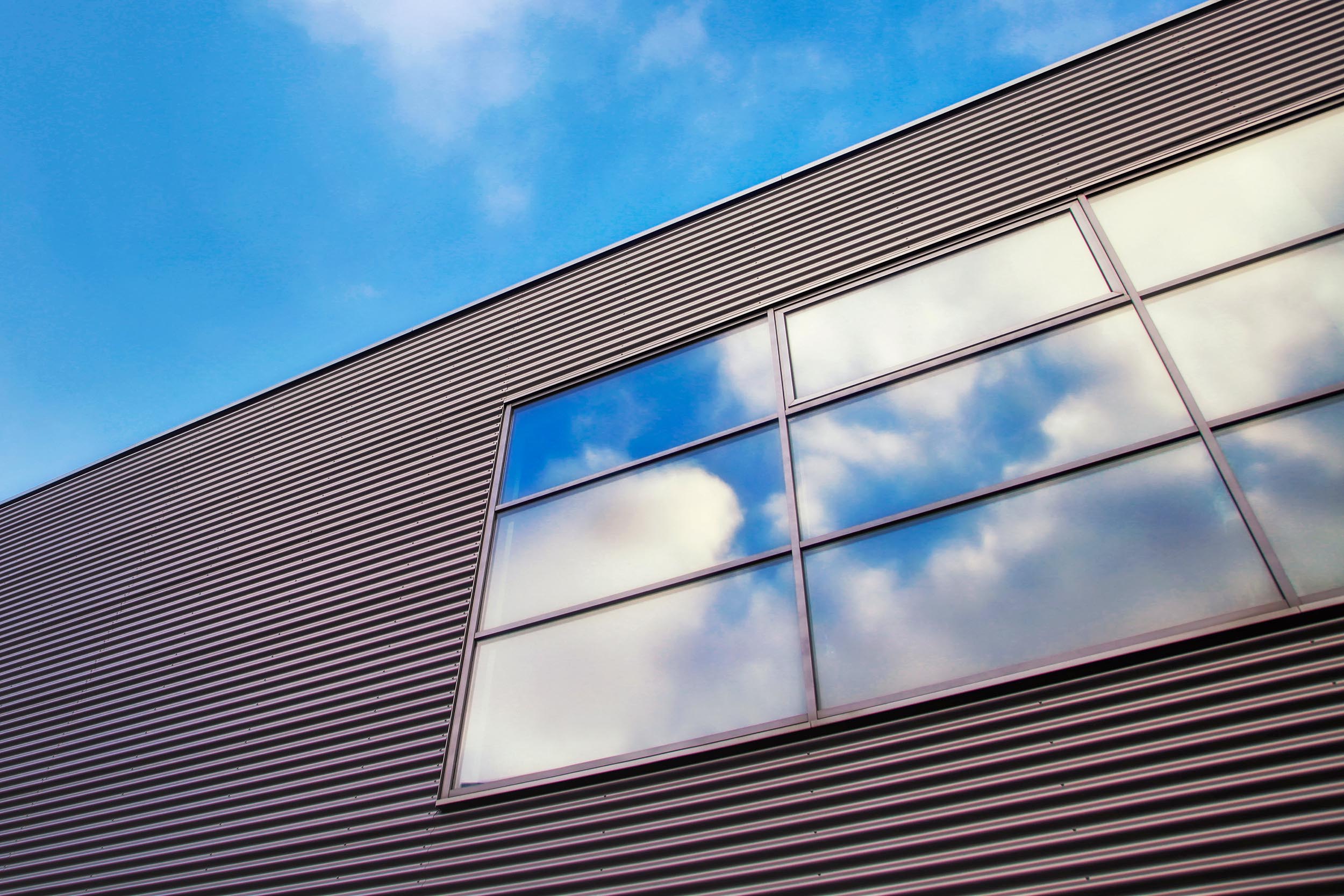 PEMB exterior windows with clouds reflected