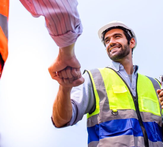 Construction Workers Fist Bump