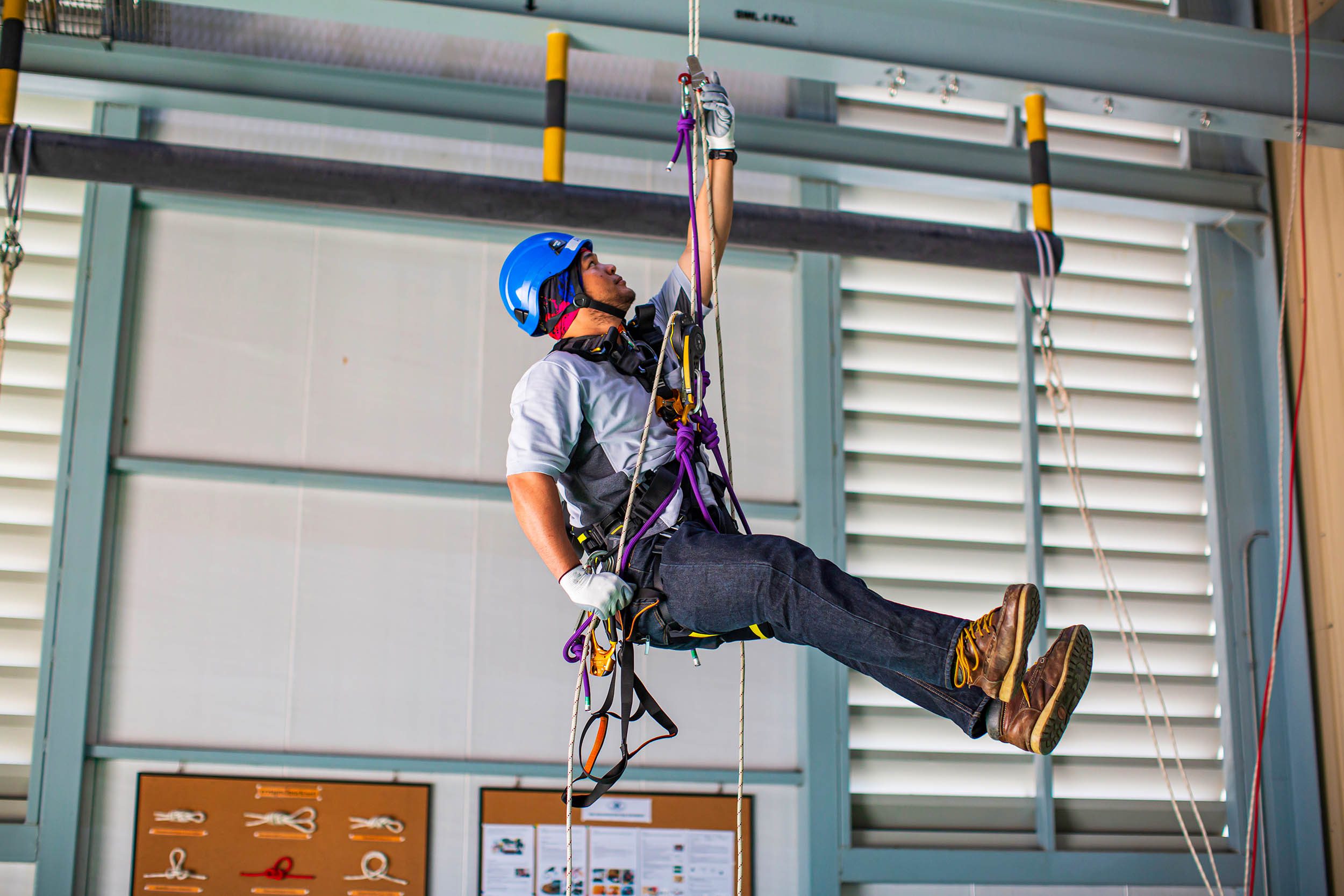 Man Belaying on a Harness on Jobsite