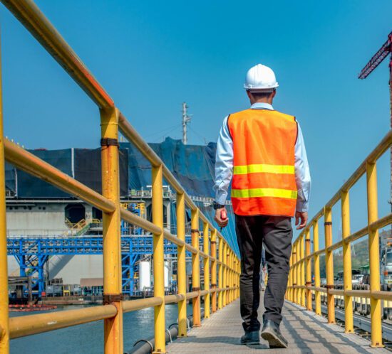 Man walking on guardrail passive fall protection system